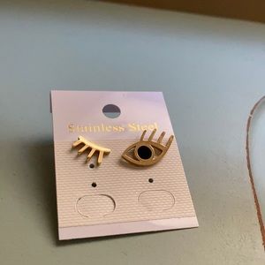 Winking eye studs